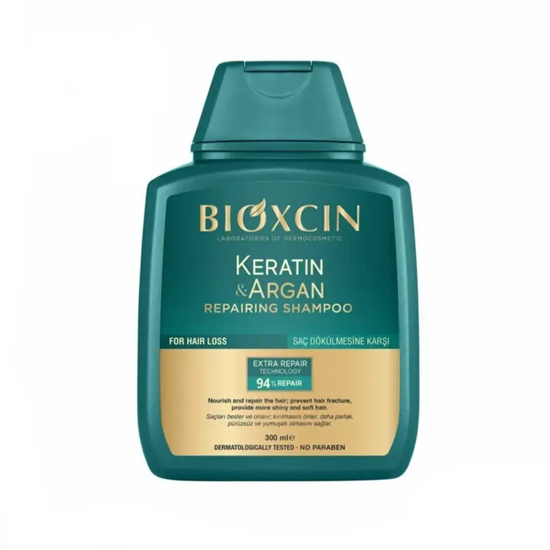 ZS0AyRVtoLh2YFlWnkem6dgo3VIInBfoNu3KluHJT2kwdRvcTe.jpg_800X800X70 شامپو ترمیمکننده بیوکسین Keratin & Argan حجم 300میل - Image 1